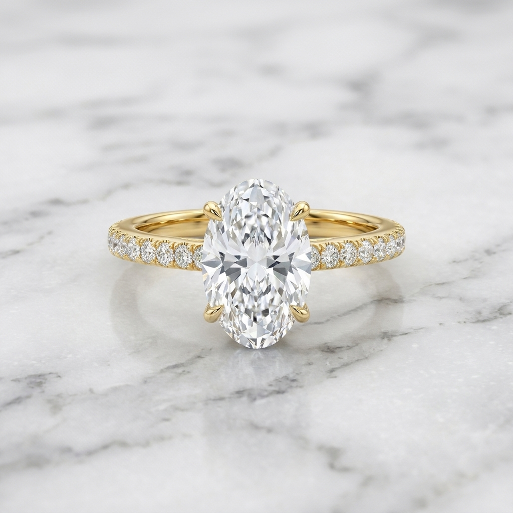 Oval solitaire engagement ring on marble